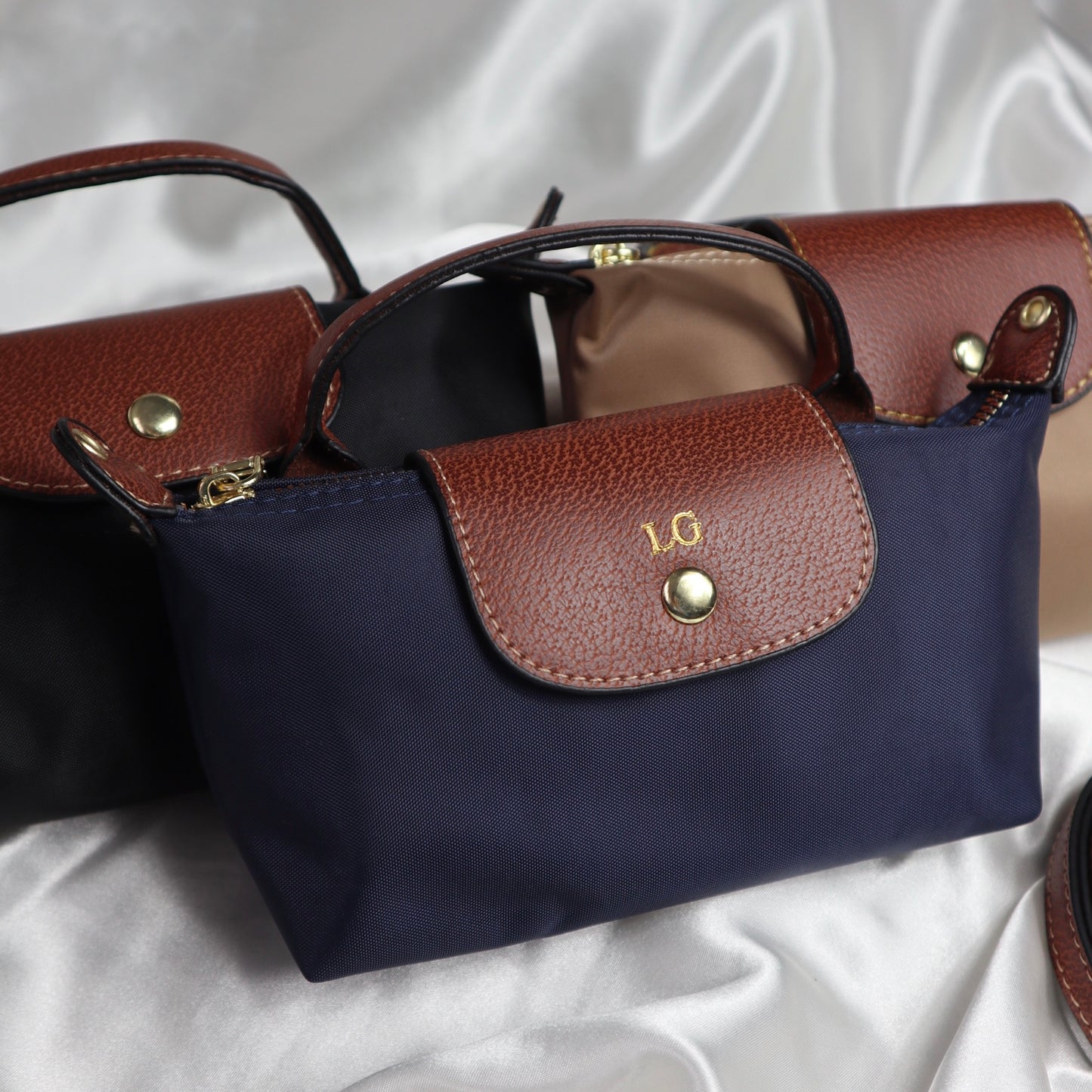 personalised nylon crossbody bags in navy black and brown customised with initials in gold. comes with adjustable strap
