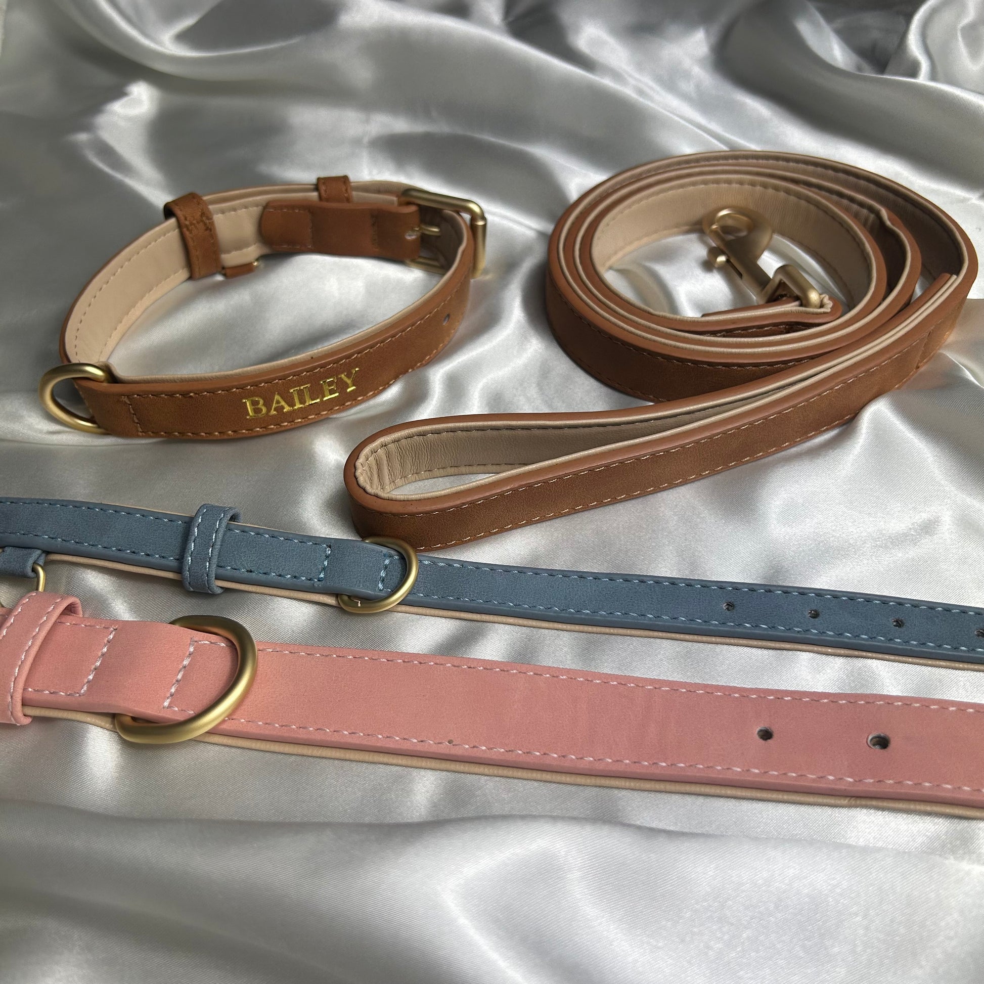 Faux suede leather dog collar and matching lead set in brown, blue and pink with gold hardware and buckles, personalised with dogs name in gold stamping