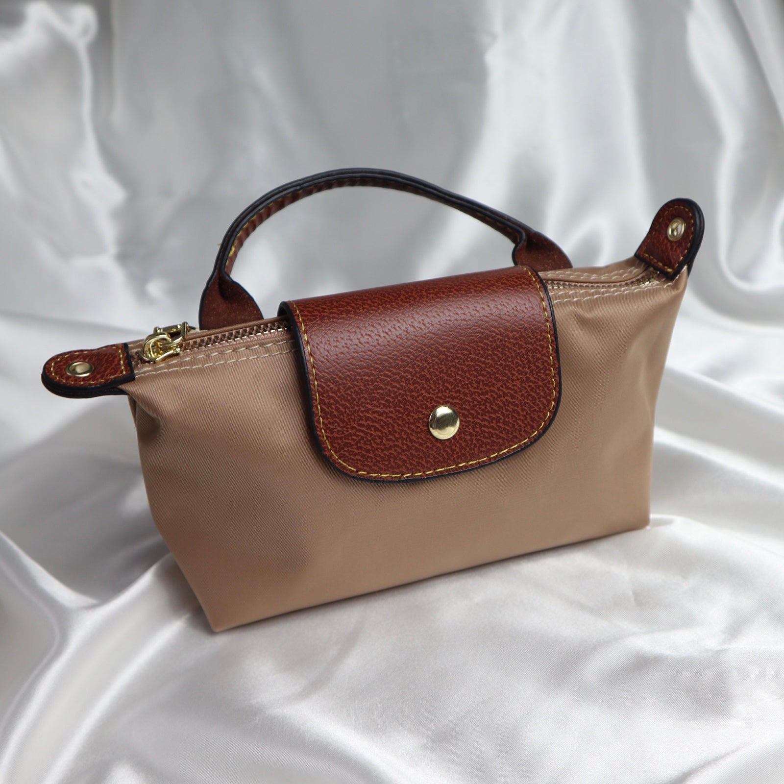 personalised nylon crossbody bag in brown which can be customised with initials in gold or silver. comes with adjustable strap