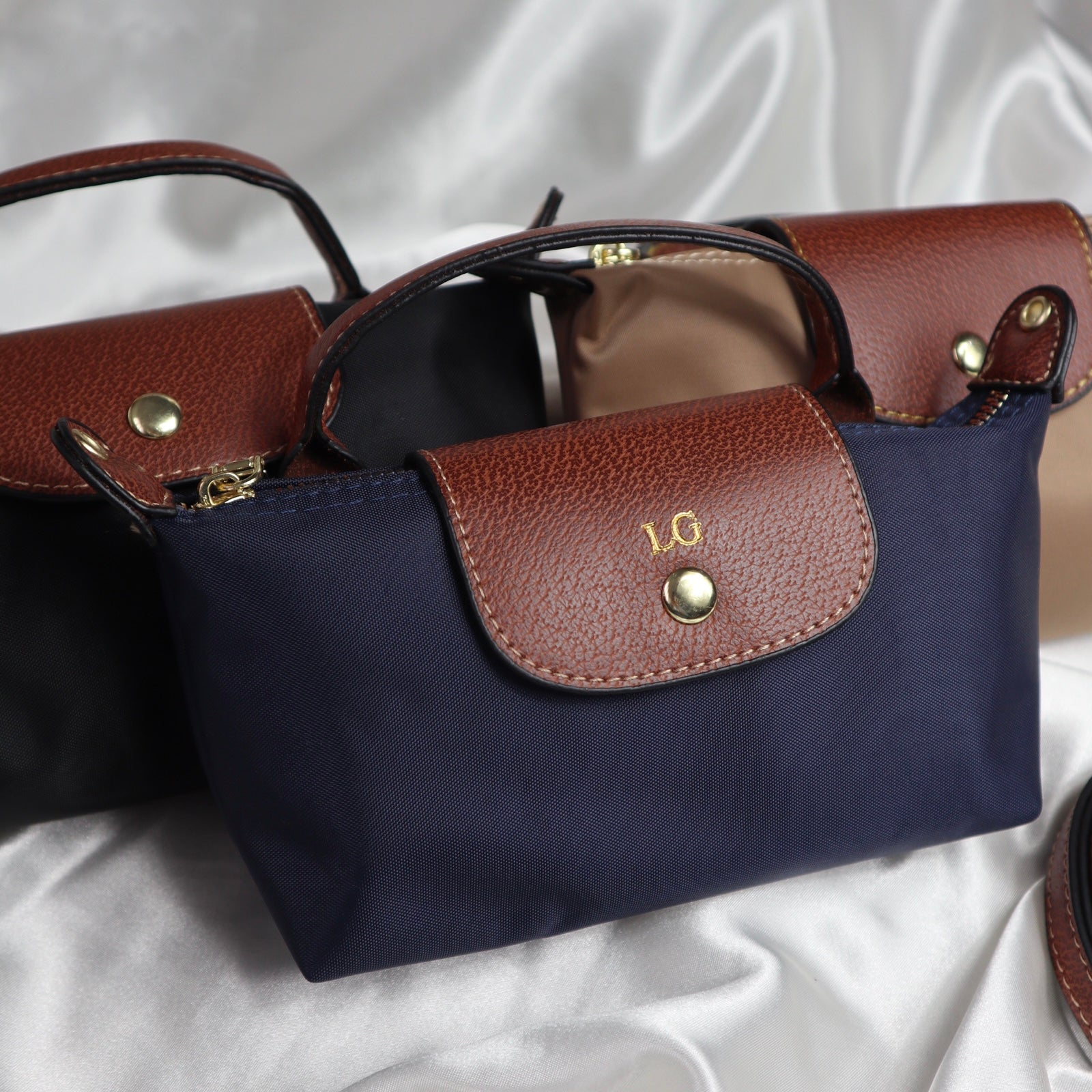 personalised nylon crossbody bags in navy black and brown customised with initials in gold. comes with adjustable strap