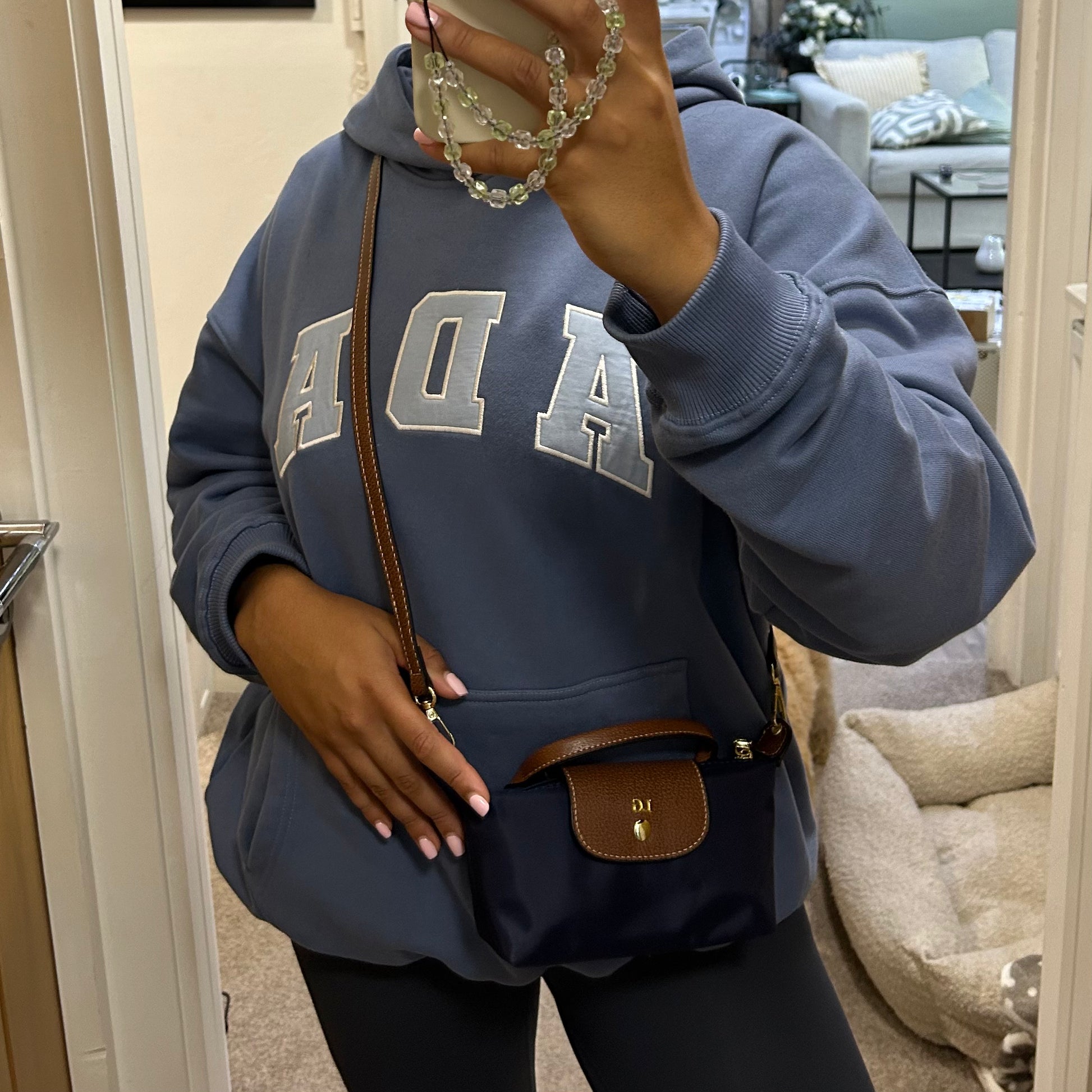 personalised nylon crossbody bag in navy  customised with initials in gold. comes with adjustable strap